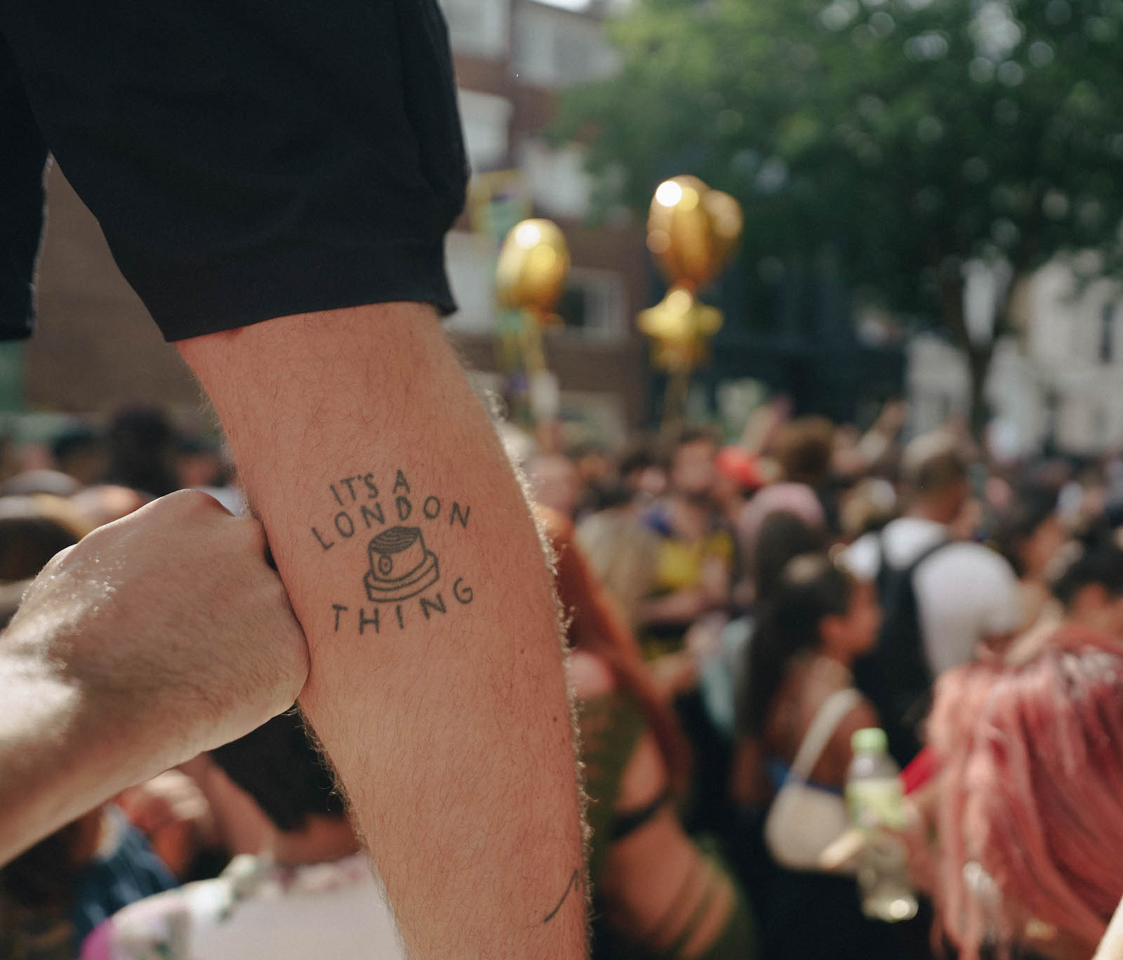 A tattoo reading 'It's a London Thing' at Notting Hill Carnival 2022